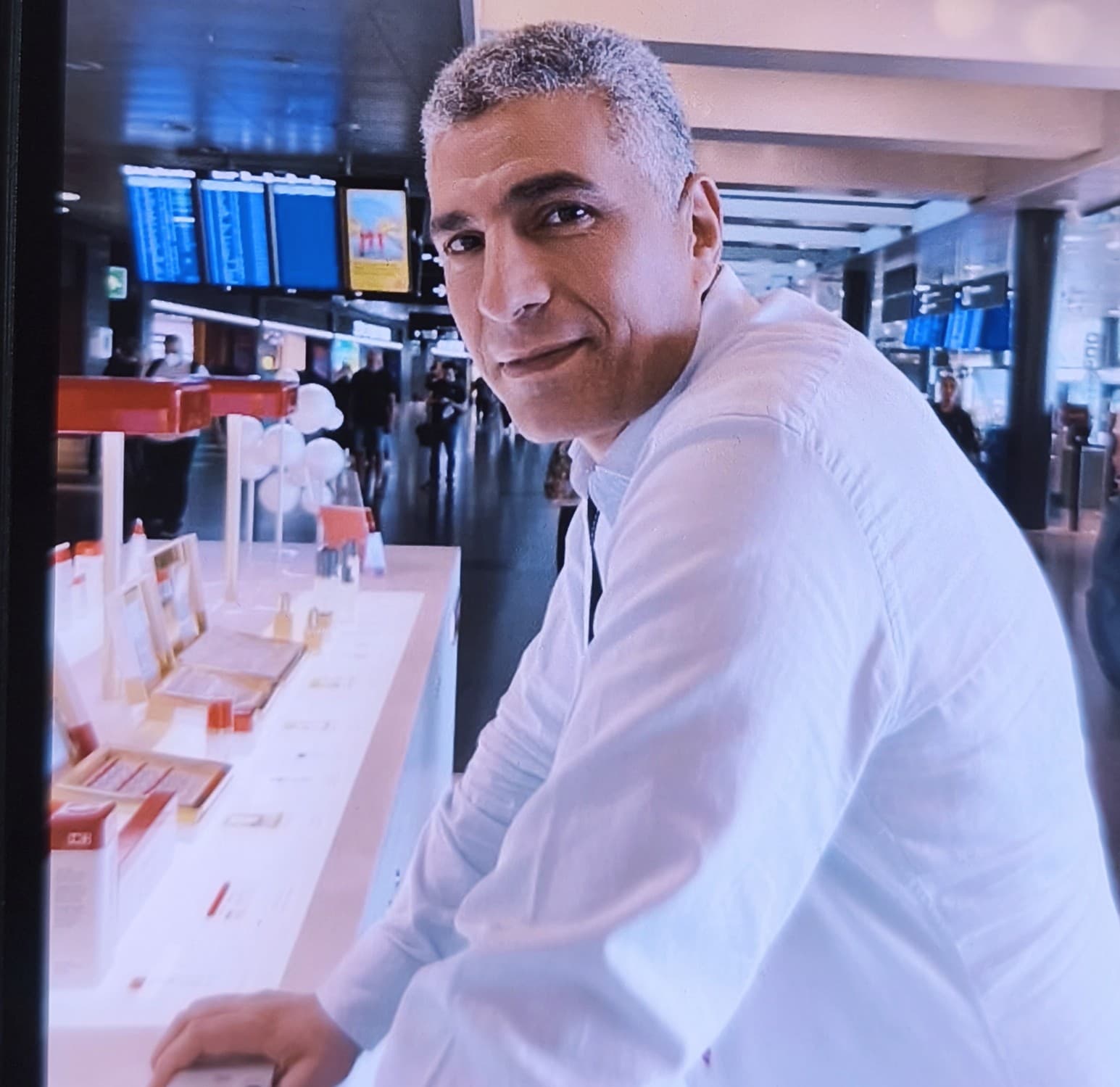 Asem Khedr, founder of Pyramids Promotions GmbH, at the fragrance counter at Zurich Airport